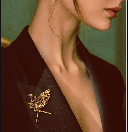 Model wearing the Archaeopteryx skeleton statement brooch